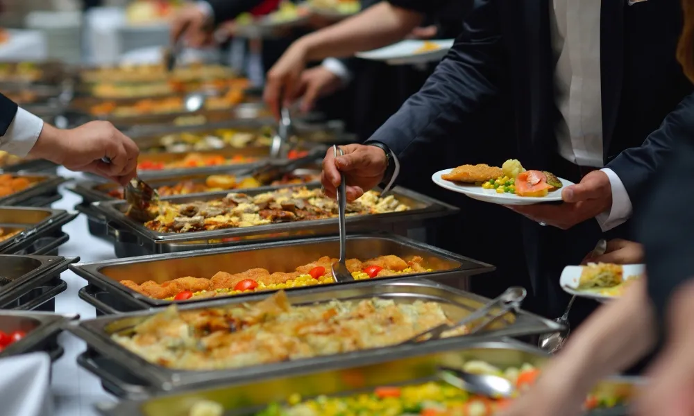 People serving food at a buffet line at CHINA BUFFET, a Buffet Restaurant in Jacksonville
